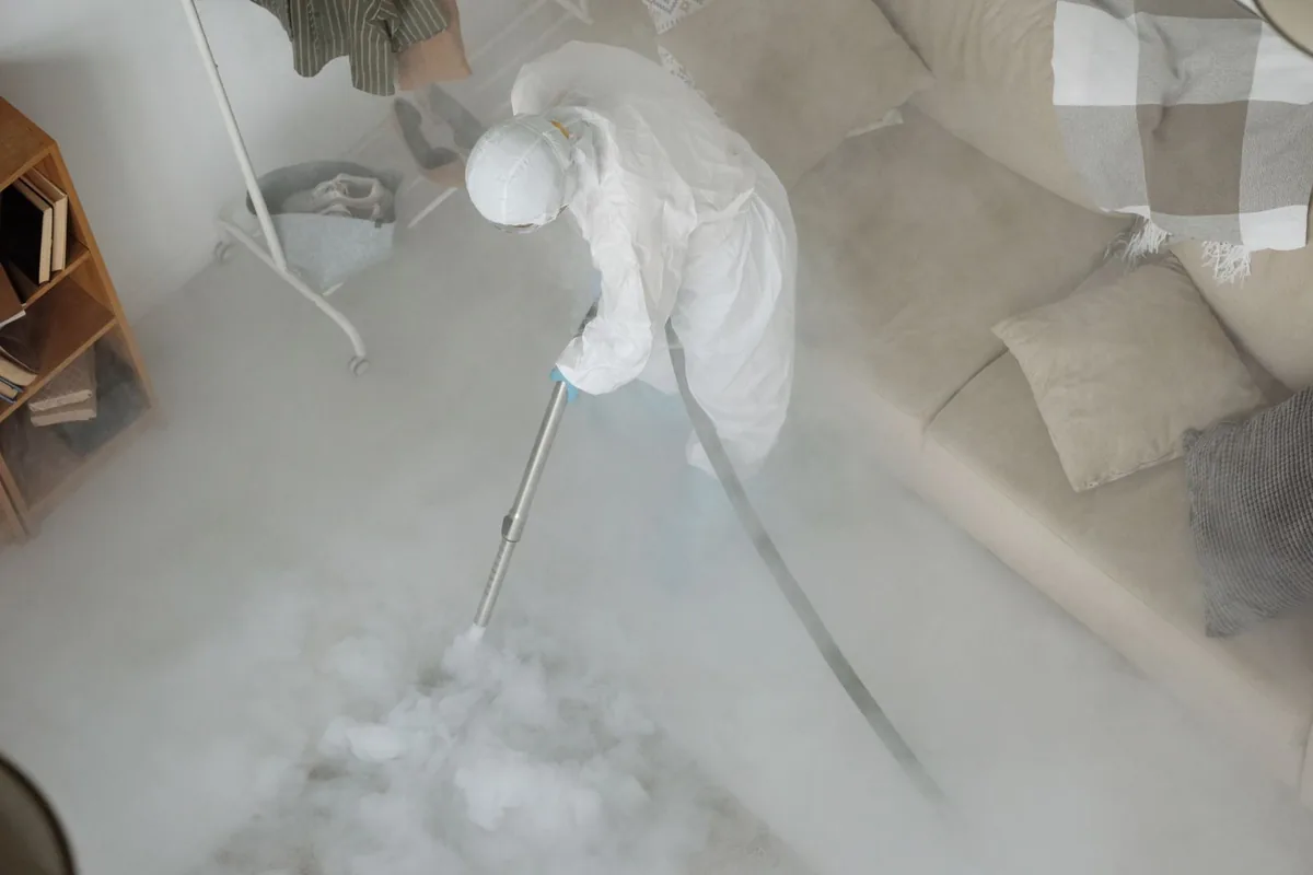 Biohazard cleanup technician in protective equipment, Massapequa Park, NY